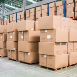 Boxes piled on top of each other in a warehouse