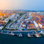 A wide shot of ships and containers at a port