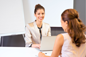 A consultant sitting with a client